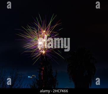 Beautiful exploding fireworks in the night sky in Naples, Italy Stock Photo