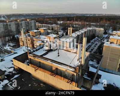 Aerial view of GSM and telecommunications antennas on the roof of the urban multistory building Stock Photo