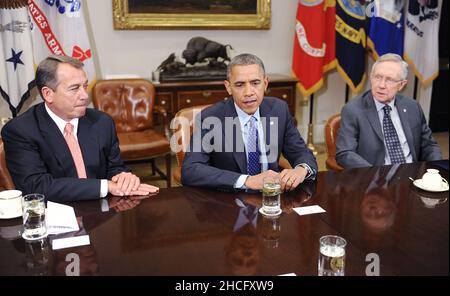 16 November 2012 - Washington, D.C. - U.S. President Barack Obama flanked by House Speaker John Boehner (L) and Senate Majority Leader Harry Reid(R) speaks a bipartisan group of congressional leaders in the Roosevelt Room of the White House on November 16, 2012 in Washington, DC. Photo Credit: Olivier Douliery/Pool/Sipa USA Stock Photo