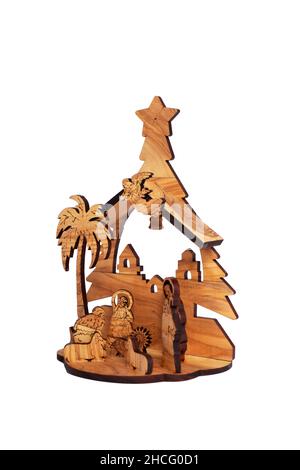 Carved wooden Nativity scene with Jesus isolated on white background Stock Photo