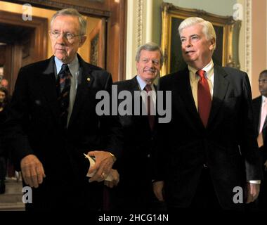 Washington, DC - December 24, 2009 -- United States Senate Majority Leader Harry Reid (Democrat of Nevada), left, U.S. Senator Max Baucus (Democrat of Montana), center, and U.S. Senator Christopher Dodd (Democrat of Connecticut) leave the U.S. Senate Chamber to make remarks to the press after voting to pass H.R. 3590, regarding health care reform in the U.S. Capitol on Thursday, December 24, 2009. The vote, which was along party lines, was 60 Democrats in favor and 39 Republicans against.Credit: Ron Sachs/CNP.(RESTRICTION: NO New York or New Jersey Newspapers or newspapers within a 75 mile Stock Photo