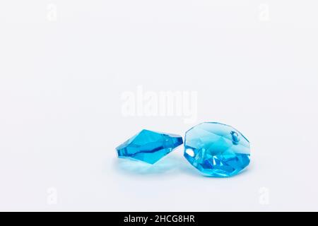 two beautiful blue crystals in plastic on a white background Stock Photo