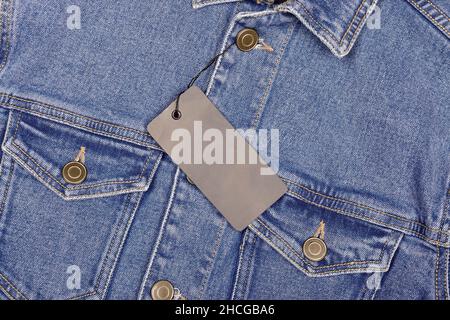 Top view of Black Tag on Denim Jacket Stock Photo