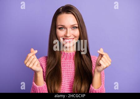 Photo of pretty lady fingers showing asian chinese heart sign wear pink knitted pullover isolated purple color background Stock Photo