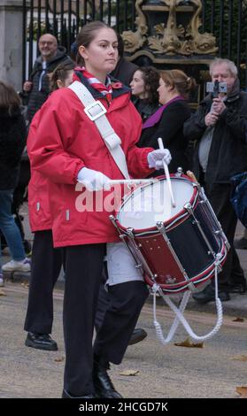 Young female drummer marching with the Kingston & Malden Scout & Guide Band at the Lord Mayor’s Show 2021, London, England. Stock Photo