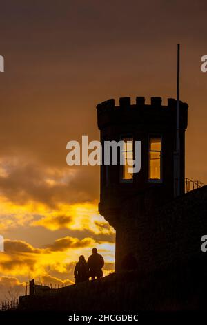 Crail, FIFE, SCOTLAND. Scotland Uk, weather. A lovely sunset fell over the small harbour fishing village of Crail in Fife, Scotland. A couple walk past Crail Castle at sunset Picture Credit: phil wilkinson/Alamy Live News Stock Photo