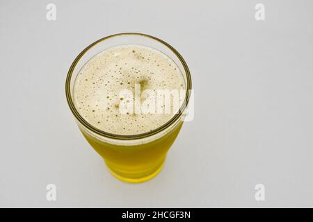 Glass of fresh and cold beer against a white background Stock Photo