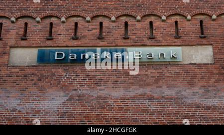 Lund, Sweden - July 13 2021: The logotype of the bank Danske Bank mounted on a historic brick wall Stock Photo