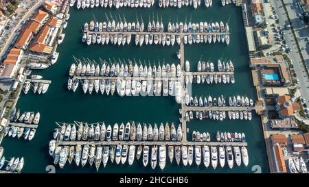 Aerial view of a harbor with anchored ships and boats in Izmir, Turkey Stock Photo