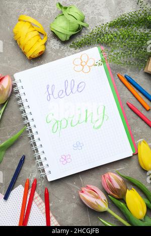 Hello spring concept on gray textured background Stock Photo