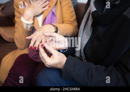Old people getting engaged. Detail of their hands Stock Photo