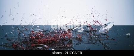 Broken wineglass process on a black table. Poured and splashing red wine, banner size Stock Photo