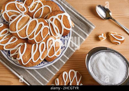 Composition with biscuits on a wooden table with sugar and teaspoon Stock Photo