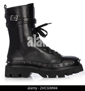 Black shoes insulated in white. Leather ankle boots insulated on white background. Unique and extravagant style. Stock Photo