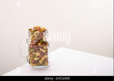 Glass Jar Filled With A Variety Of Nutrition And Healthy Snacks And 