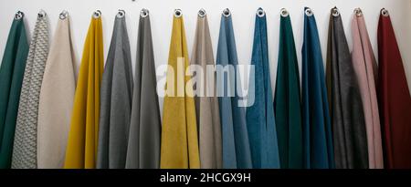 Samples of fabrics for sewing furniture on a white background. Stock Photo