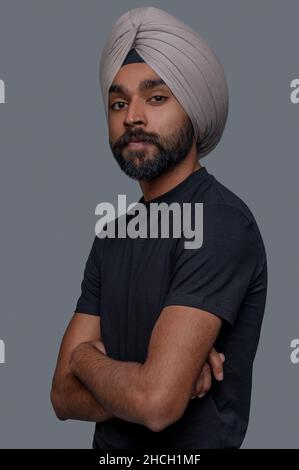 Serene Indian guy in the turban gazing before him Stock Photo