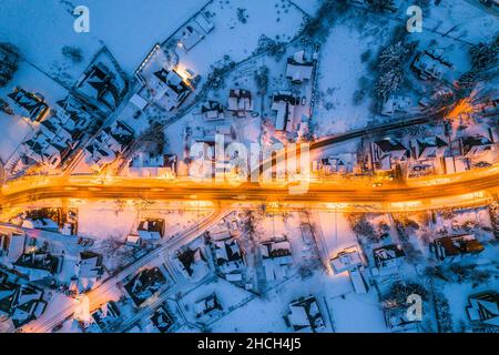 Illuminated Street in Winter Zakopane Town. Top Down Drone View. Stock Photo