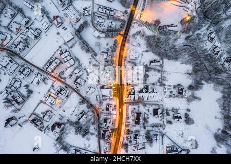 Illuminated Street in Winter Zakopane Town. Top Down Drone View. Stock Photo