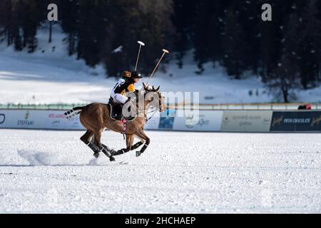 Juan Bautista Peluso (black) of Team Badrutt's Palace Hotel battles Santiago Marambio (white) of Team Azerbaijan Land of Fire, 36th Snow Polo World Stock Photo