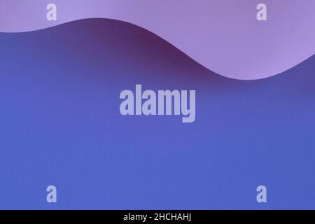 Abstract wave of pastel blue, purple, very peri color paper. Creative geometric curved paper with light and shadows. Abstract geometry vertical Stock Photo