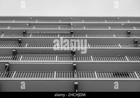 A grayscale low angle shot of a modern balcony building Stock Photo