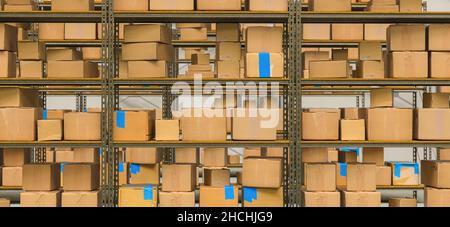 warehouse interior with shelves and cardboard boxes, Packed courier delivery concept image Stock Photo