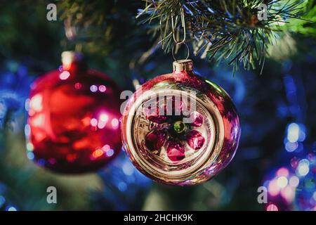 Retro Christmas bauble on Christmas tree closeup, holiday home decoration Stock Photo
