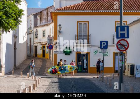 LAGOS, PORTUGAL - OCTOBER 23rd 2021: Tourists roam the streets of historic old town of Lagos, Portugal. Stock Photo