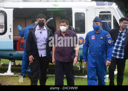 President Rodrigo Roa Duterte continues his inspection of areas severely devastated by Typhoon ‘Odette. This is part of his ground inspections of TS Odette-stricken areas in Central Visayas & Mindanao. President Duterte personally checks the condition of the affected people currently staying in an evacuation center and talks with the local government officials, together with government agencies concerned, extends assistance to the families and individuals distressed by the typhoon, as part of the government's commitment to deliver immediate relief and rehabilitation efforts. Stock Photo