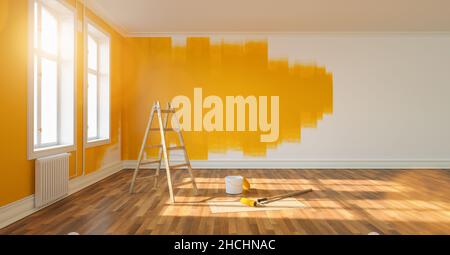 Painting wall yellow in room of apartment after relocation with ladder and paint bucket Stock Photo