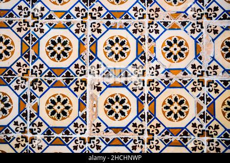 Old Portuguese tiles called azulejo found on the wall in Sesimbra, Portugal Stock Photo