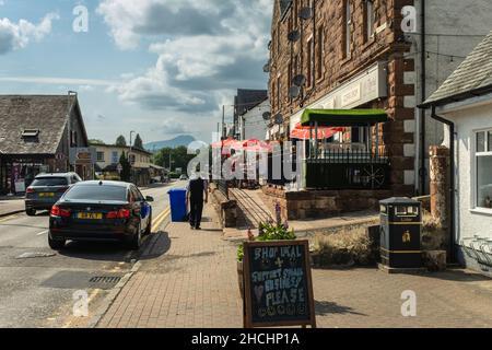 Aberfoyle, Scotland - July 25th 2021: Main street in Aberfoyle in summer with Ben Lomond in the background, Trossachs, Scotland