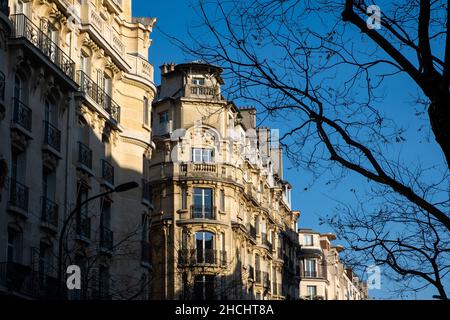 A perspective of classical facade in Paris with light and shadow Stock Photo