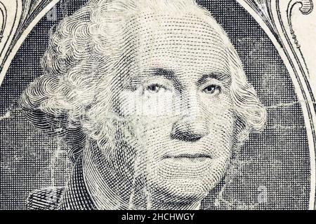 Macro view of George Washington on worn out dirty US one dollar bill. Stock Photo
