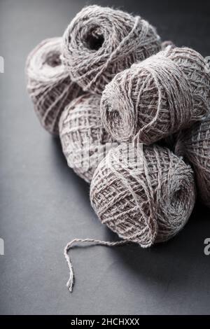 Balls of brown wool yarn made of natural wool. Needlework Stock Photo
