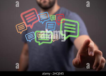 Message icons in front of a person / email concept Stock Photo - Alamy