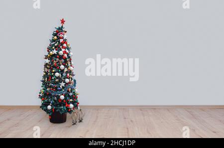 christmas tree on hardwood floor Stock Photo