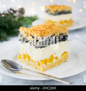 Christmas cheesecake with peaches, coconut and poppy seeds. Stock Photo