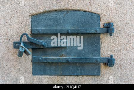 Stockholm, Sweden - April 17, 2021: Iron cast small doors on the historical building Stock Photo