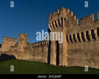 Beautiful view of the medieval city walls (construction ca. 14th century) in the historic center of Avignon, Provence, France in the afternoon sun. Stock Photo