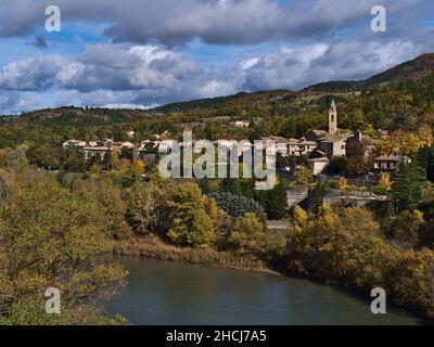 Beautiful view of the north of town Sisteron in Provence, France with church and traditional houses surrounded by colorful trees in autumn season. Stock Photo