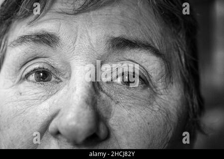 Closeup shot of a Hispanic female's eyes in grayscale Stock Photo