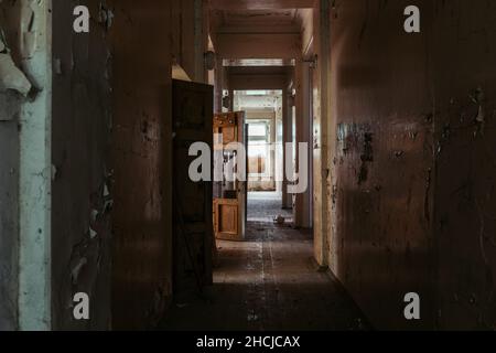 Dark and creepy corridor of old abandoned mental hospital Stock Photo