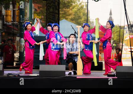 Toronto, Canada - 08 19 2018: Traditional Chinese dance performers on the main stage of the 18th Toronto Chinatown Festival. Stock Photo