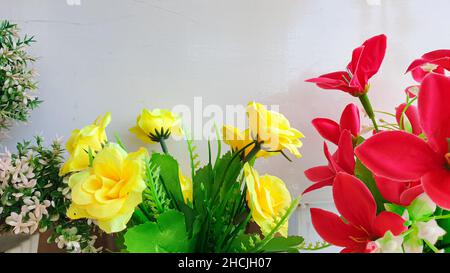 artificial bouquet of roses and lilies, home interior and exterior decoration. Stock Photo