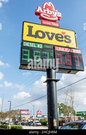 Fort Ft. Pierce Florida Love's gas petrol station convenience store outside exterior giant large sign prices per gallon diesel unleaded Arby's drive Stock Photo