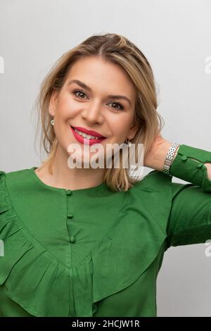 Portrait of a beautiful woman, looking at the camera on white background Stock Photo