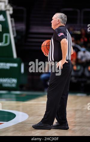 Coral Gables, Florida, USA. 29th Dec. 2021.   Referee during the Men’s Basketball between Miami Hurricanes vs NC State in Watsco Center. Credit: Yaroslav Sabitov/YES Market Media/Alamy Live News Stock Photo