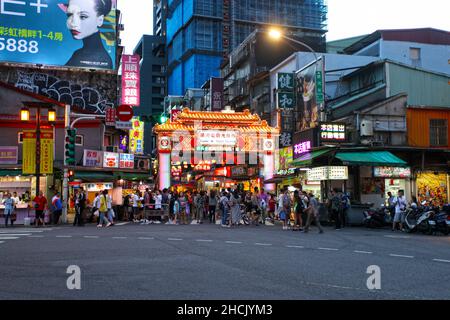 Raohe Street Night Market in the Songshan district of Taipei in Taiwan, one of the most famous night markets in Taipei famous for street food. Stock Photo